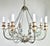 Eight arm painted iron & wood Melissa Levinson chandelier. The iron is beautifully scrolled with wood painted bobeches....