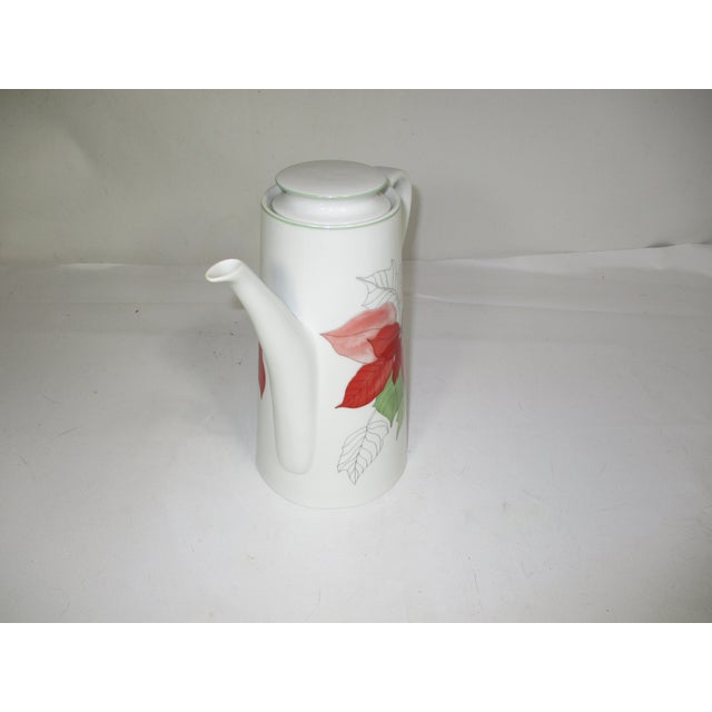 A vintage porcelain tea pot made by Block Spal in Portugal. The poinsettia pattern is from the watercolor series design by...