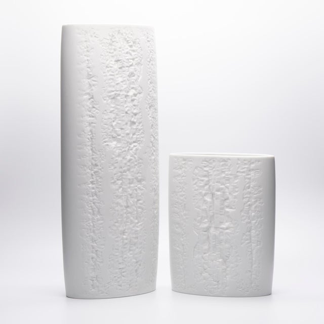 Curated pair of matte white bisque porcelain vases designed by martin freyer for rosenthal studio-line. The set combines...