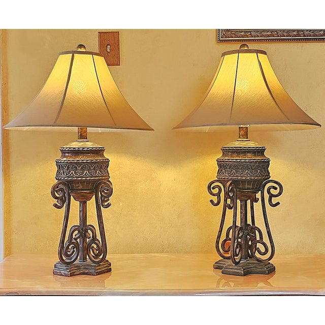 This stunning pair of Mid-Century Modern table lamps by Anthony California combines gothic medieval styling with a...