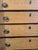 This is an antique chest of drawers. It is American. It is tiger maple wood. There are six drawers for storage. It has a...