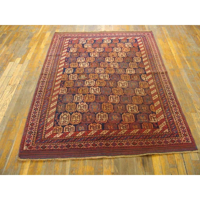 Antique Afshar Small Scatter Size Wool Blue Rug, Circa Date: 1890s. This exquisite example of tribal weaving originates...