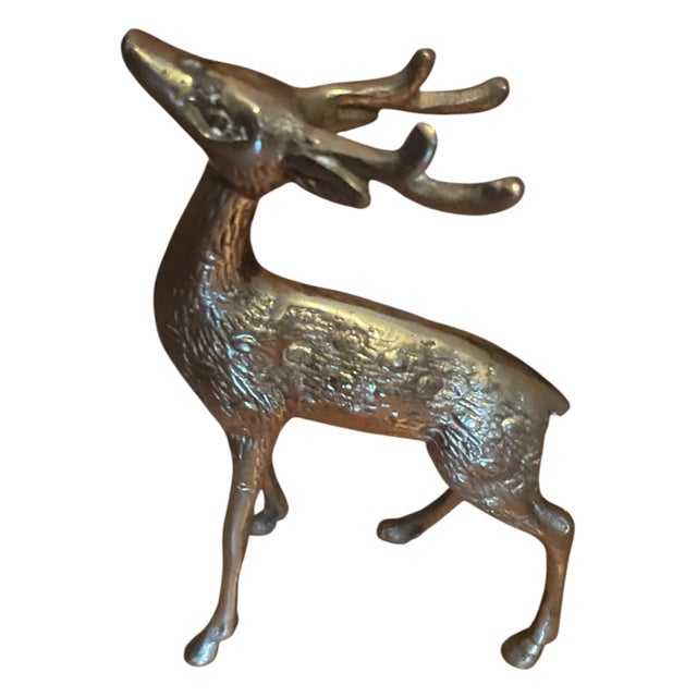Adorable 1970s brass deer figurine, depicting a majestic antlered young buck. Solid heavy brass. Etching on the figurine...