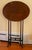 Antique Edwardian mahogany side table with a simple oval-shaped tilt top, slender turned legs and stretcher and shaped...