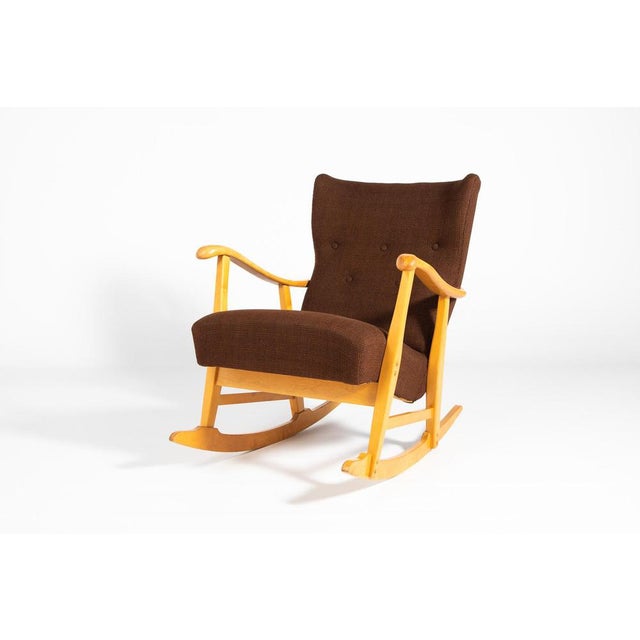 A rare and important Sculptural rocking chair designed by Elias Svedberg for Nordiska Kompaniet, Sweden 1950s. Frame in...