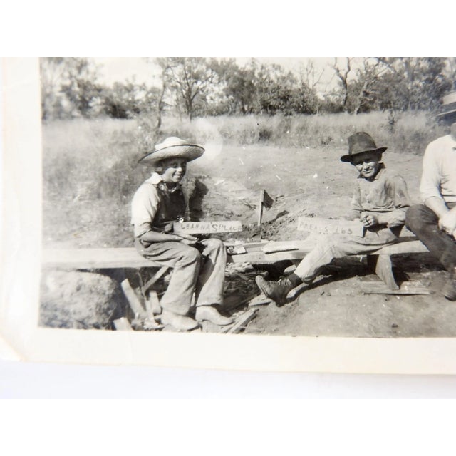 Circa 1920's snapshot photograph. Children showing off hand made signs for Leannas Place & Meals $1.65, girl holding...