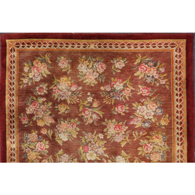 Antique Hand Knotted European Savonnerie Rug in Wool with Floral Design This antique French Savonnerie was in the...