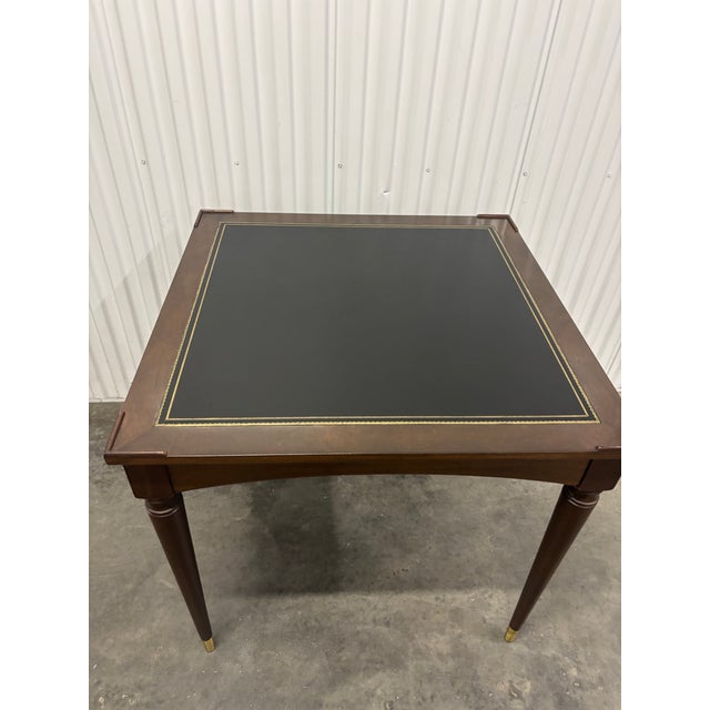 Elegant and versatile, this vintage game table by Fine Arts Furniture Company combines classic craftsmanship with refined...