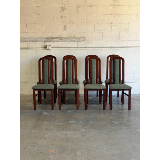 This set of eight high back dining chairs features a sleek vertical profile and supportive frame. The tall backs...