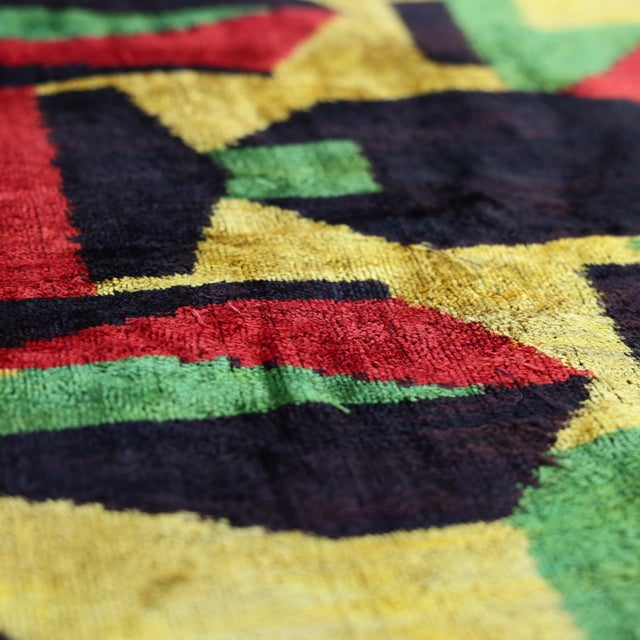 "Infuse your space with the avant-garde energy of this masterfully hand-knotted silk velvet ikat pillow. Measuring 16x16...