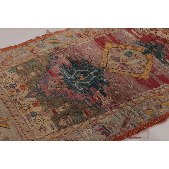 Hand knotted in wool and originating from Turkey circa 1880-1890, this 3x5 antique rug hails from the Ghiordes region of...