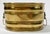 Vintage oblong decorative brass planter featuring lion head ringed handles at each end. Interior measures 10"W x 6.5"D....