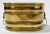 Vintage oblong decorative brass planter featuring lion head ringed handles at each end. Interior measures 10"W x 6.5"D....