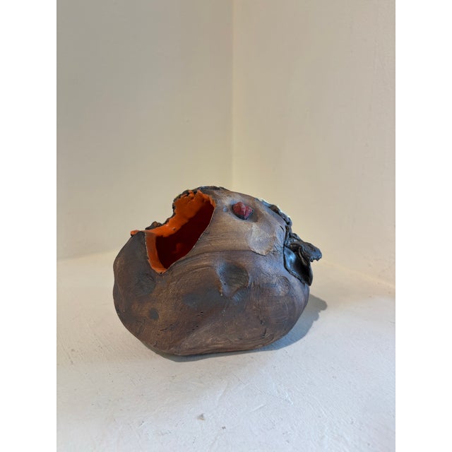 Geode with fungus and orange exterior Ceramic 5.5 x 6 x 7 I have a recurring fantasy that, while fossil hunting, I come...
