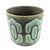 Offered is a circa. 1970s glazed stoneware decorative planter with a geometric pattern in contrasting shades of green made...