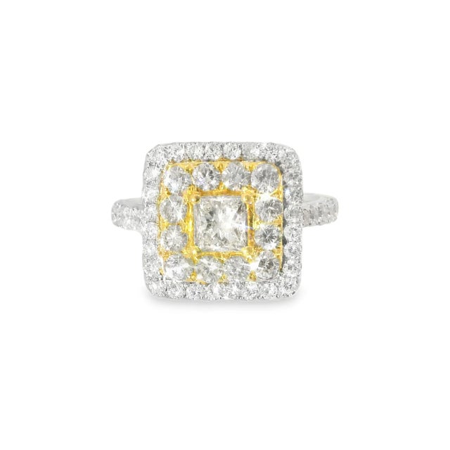 18K 2-tone gold ring featuring a 5mm square center diamond, surrounded by brilliant round diamonds totaling 1.67 carats....
