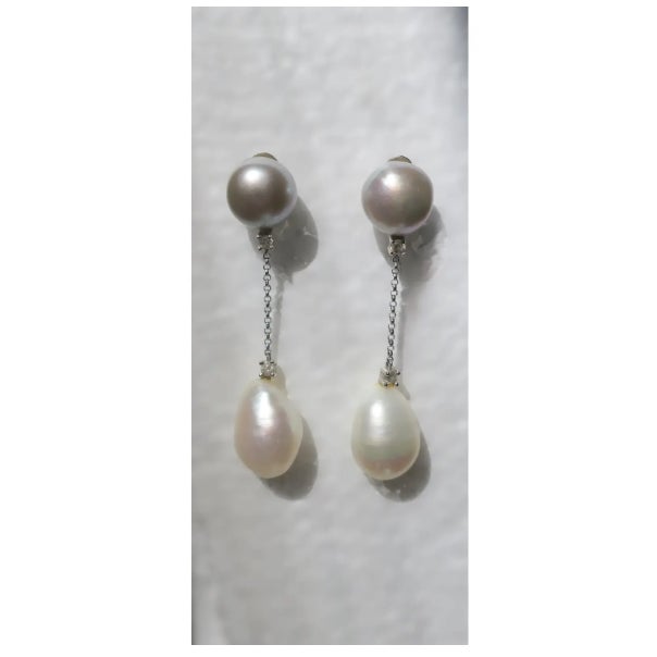 A beautiful Italian pair of white and grey freshwater pearl and diamond dangle earrings set in 18-karat white gold, circa...