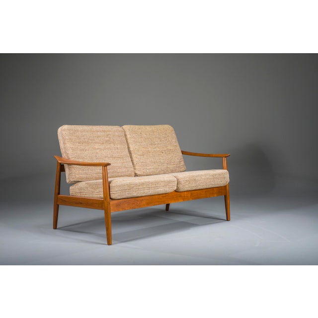 Elegant Danish Modern seating set by Arne Vodder, crafted in solid teak and professionally restored in our workshop. The...
