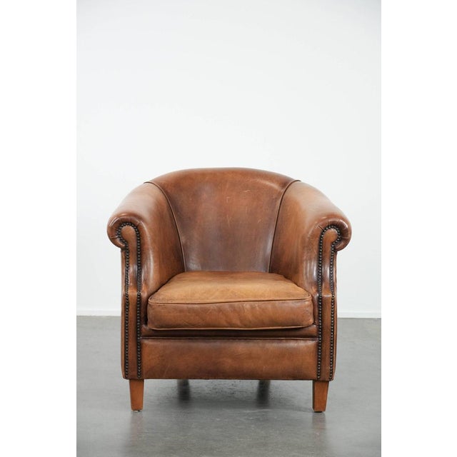 We are offering this attractive and comfortable club chair made of sheepskin leather with a beautiful light and warm color...