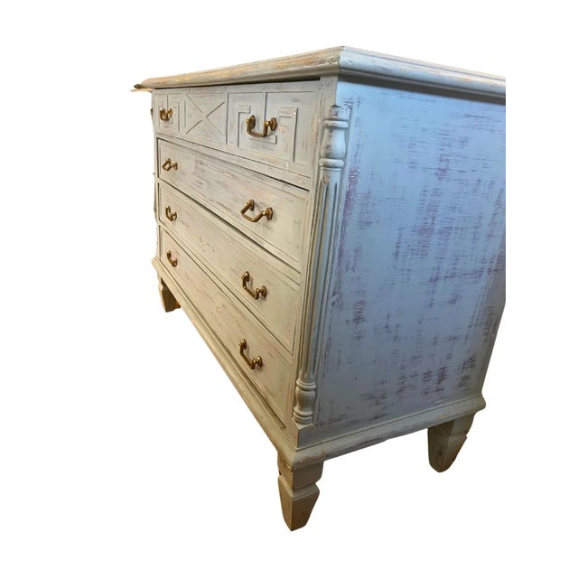 A painted Swedish-style dresser with four spacious drawers each and brass pulls. Perfect for bringing both elegance and...