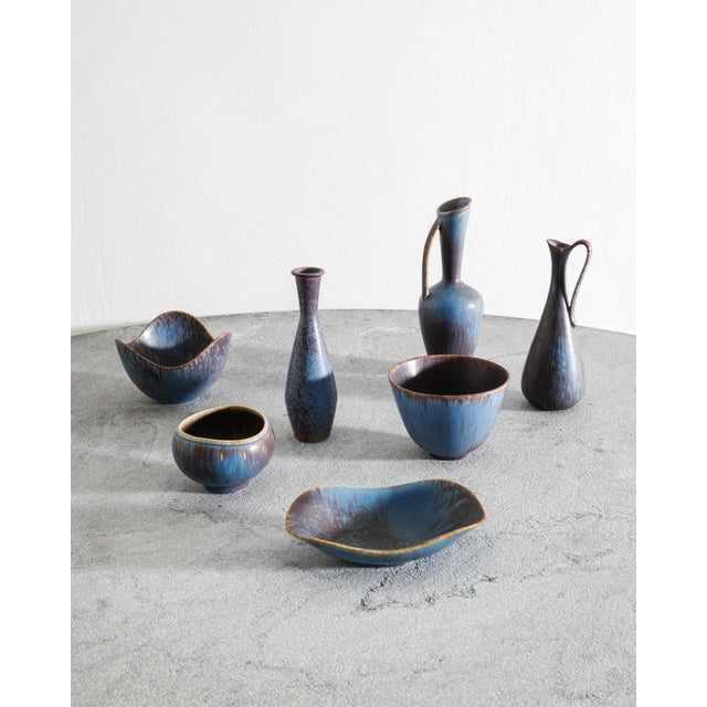 A rare and decorative hand picked collection of Swedish mid century ceramic vases, pitchers and bowls in a blue brown...