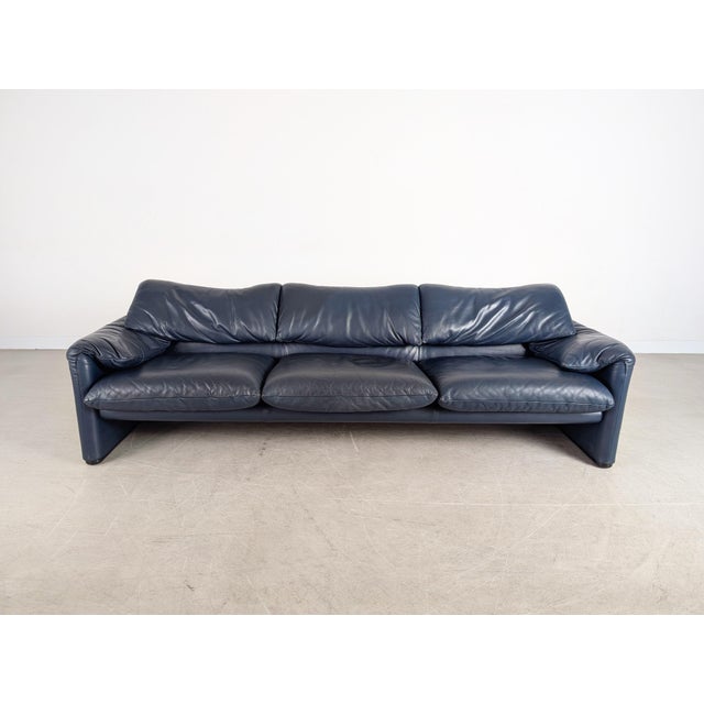 We are offering a beautiful dark blue three-seater leather sofa from the premium Italian manufacturer Cassina for sale....