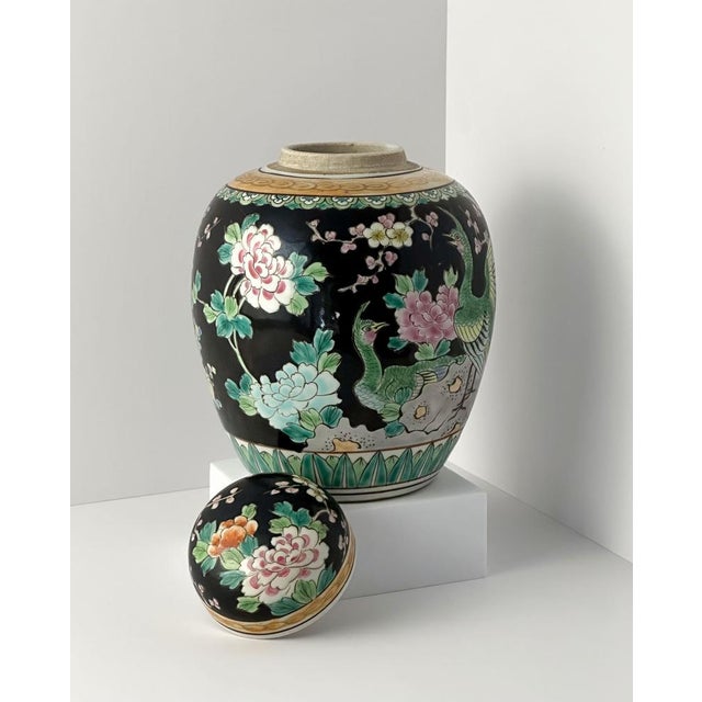 A Japanese black polychromed porcelain ginger jar. Handcrafted towards the end of the 19th century during the Meiji period...