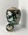 A Japanese black polychromed porcelain ginger jar. Handcrafted towards the end of the 19th century during the Meiji period...