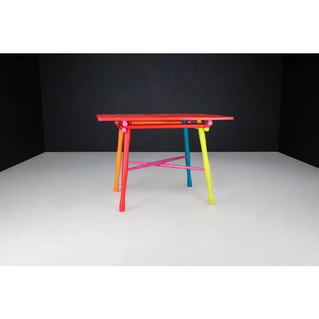 Mid-Century French Folk Art Painted Beechwood Table, France, 1960s A joyful expression of color and craftsmanship, this...
