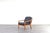 A lounge chair made in Denmark in the 1970s by Dyrlund, as confirmed by the original metal maker's badge on the frame. The...