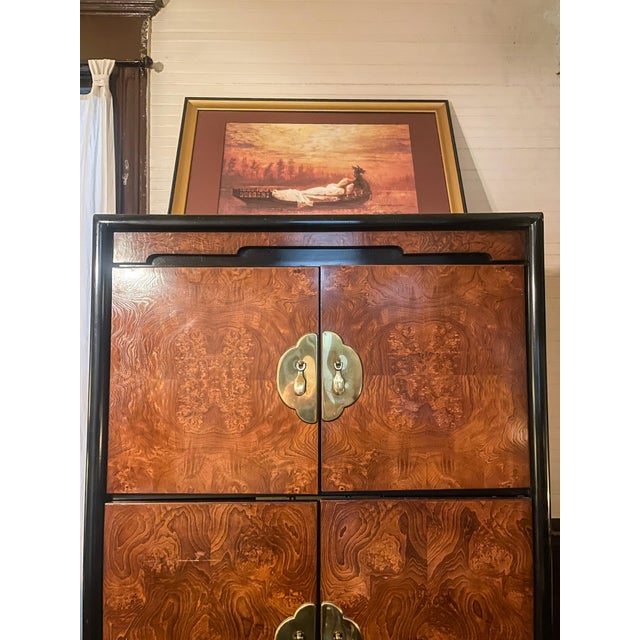 Bernhardt burl wood entertainment cabinet with pagoda style brass hardware, and black lacquer frame. Solid wood and heavy....