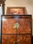Bernhardt burl wood entertainment cabinet with pagoda style brass hardware, and black lacquer frame. Solid wood and heavy....