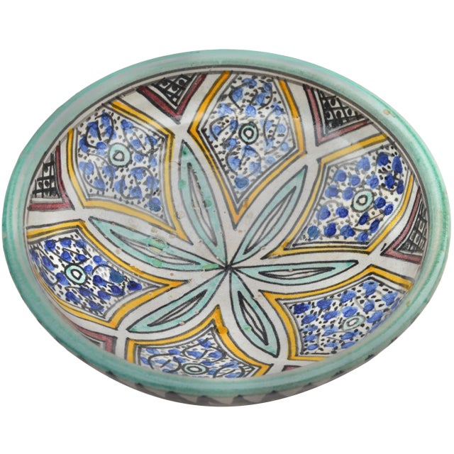 Vintage handcrafted and glazed Moroccan ceramic bowl featuring an elaborate hand-painted colorful Arabesque floral...