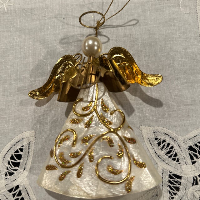 A beautiful Capiz shell angle ornament. Gift to me. Ready for a new home I’m downsizing and would like to find a new home...
