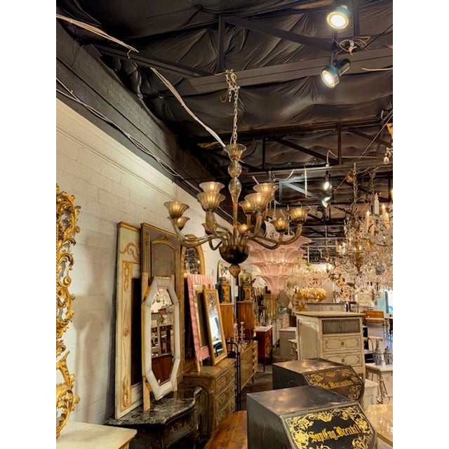 Beautiful modern "fume" colored Murano glass chandelier with two tiers of lights. 12 Lights total. Makes a very impressive...