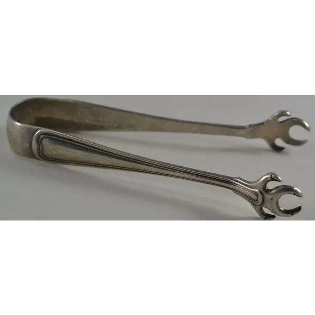 This is a good, sturdy pair of Gorham sterling silver tongs in the Old French Pattern for picking up sugar cubes adding...