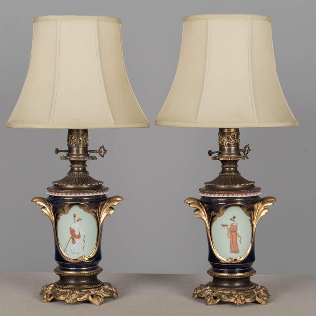 Pair of 19th century French "Vieux Paris" bronze mounted hand-painted porcelain lamps. Opulent cobalt blue urn form vase,...