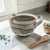 A hand-thrown California studio pottery batter bowl, signed “Margie” and dated 1980, reflecting the regional studio craft...