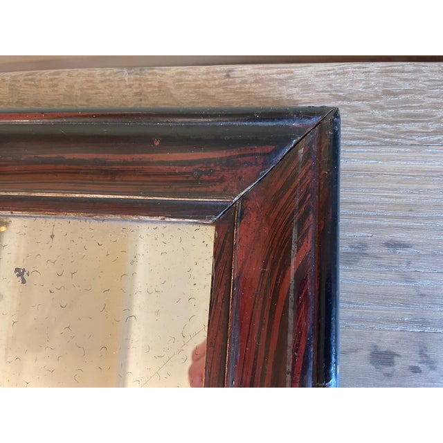 The small mirror is wood-grained; this is an old painting technique. The small mirror is made of wood and plaster. Very...