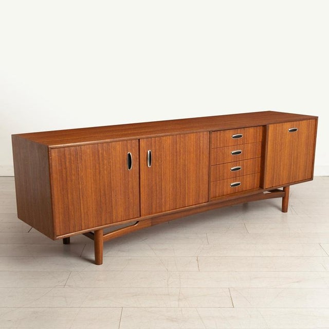 Mid Century G-plan sideboard in tola with metal handles by Victor Wilkins, circa 1960s. Excellent restored condition. H:...