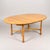 Classic Ercol Saville oval dining table, crafted in beautifully grained solid blonde elm, showcasing the elegant...