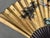A striking large-format decorative fan featuring a gold-leafed paper/silk panel hand-painted in the traditional East Asian...