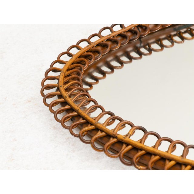 Rattan and bamboo teardrop mirror, Made in Italy, 1950s. Elegant teardrop-shaped mirror with hand-woven rattan frame....