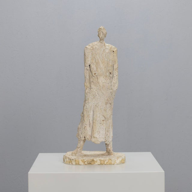 This expressive modernist sculpture depicts a standing male figure reduced to its essential form. Executed in the...