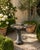 A wonderfully sculptural vintage cast concrete birdbath in the form of a stylized clam shell, raised on a substantial...