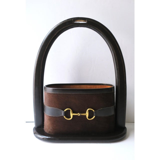 A beautiful Italian leather, hide, and brass bit mail and magazine holder, attributed to fashion house Gucci, circa...