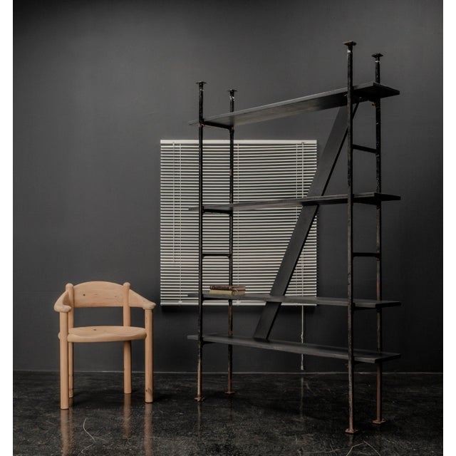 This shelf was designed by an architect in Germany during the 1920s and 1930s. The frame is made of square section metal...