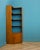 A large teak corner shelving unit from Herbert Gibbs, circa 1960s. The bottom shelf is removable. There is a cupboard to...