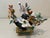 Mid Century carved multi semi precious stones Bonsai flower tree in a brass pot inlaid with dark green jade panels. The...