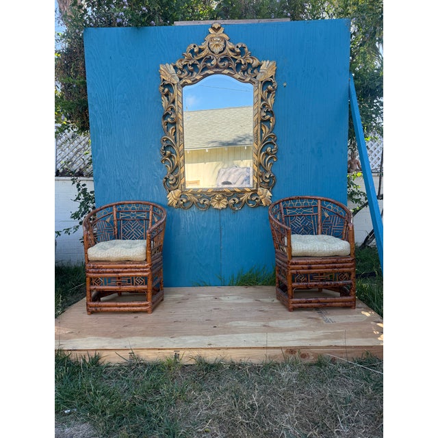 A nice size water Gilt Florentine mirror with lovely Foliate Scrolls. Ornately hand-carved openwork showcasing stylized...
